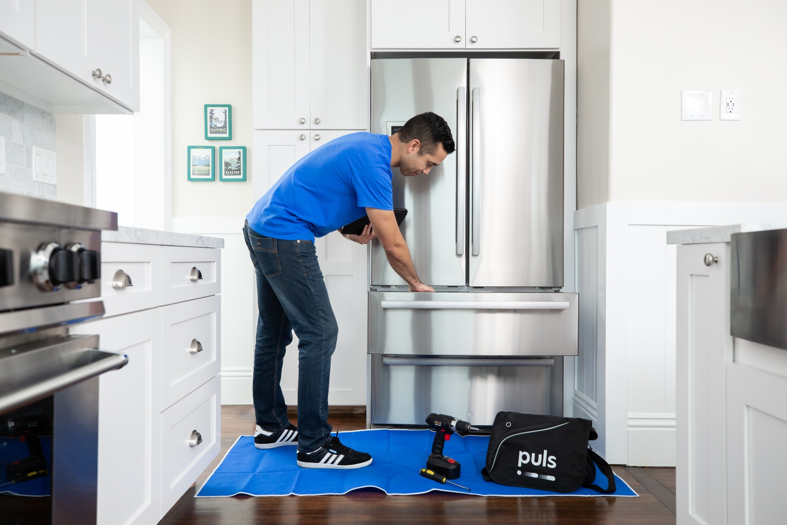 Puls technician checking fridge