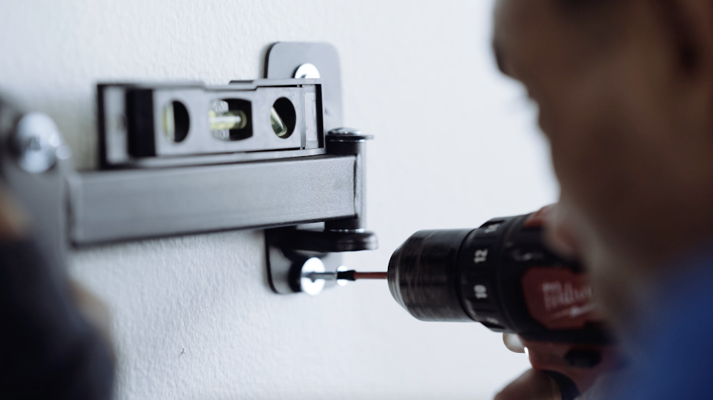 drilling screws into the wall