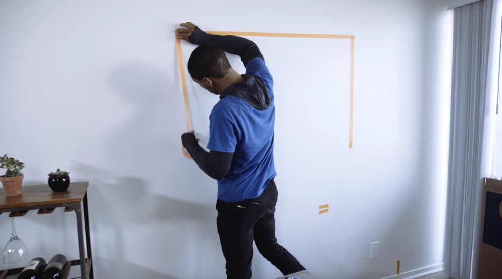 How to Mount a TV - Lay Down Tape on Wall
