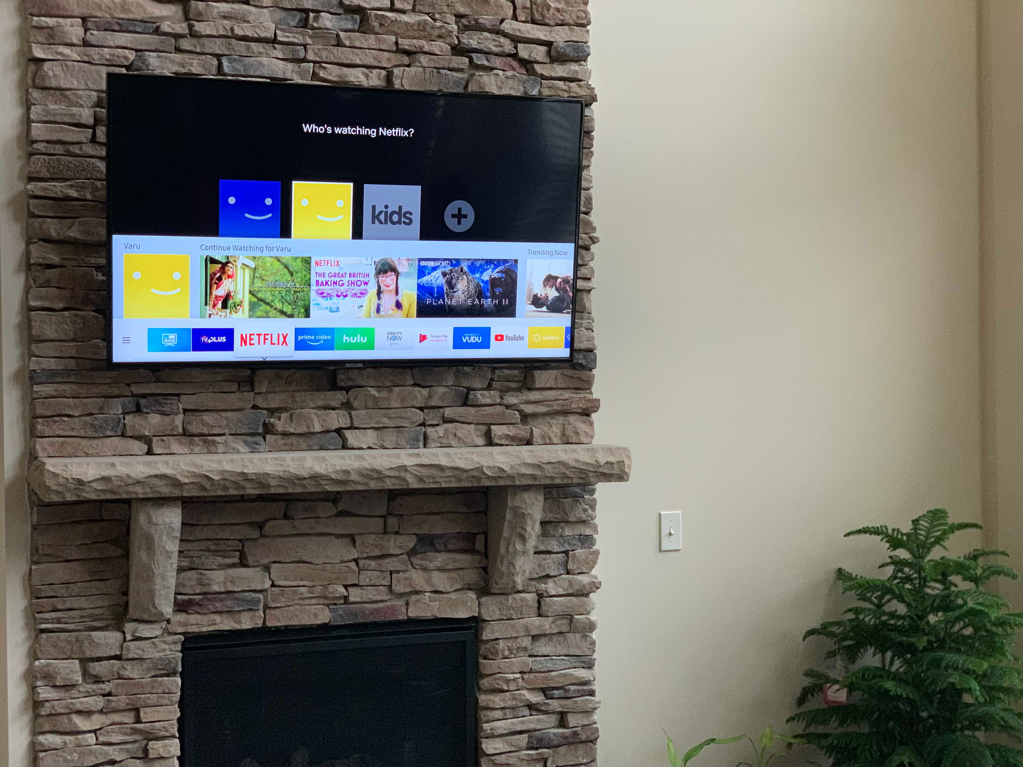 TV above brick fireplace