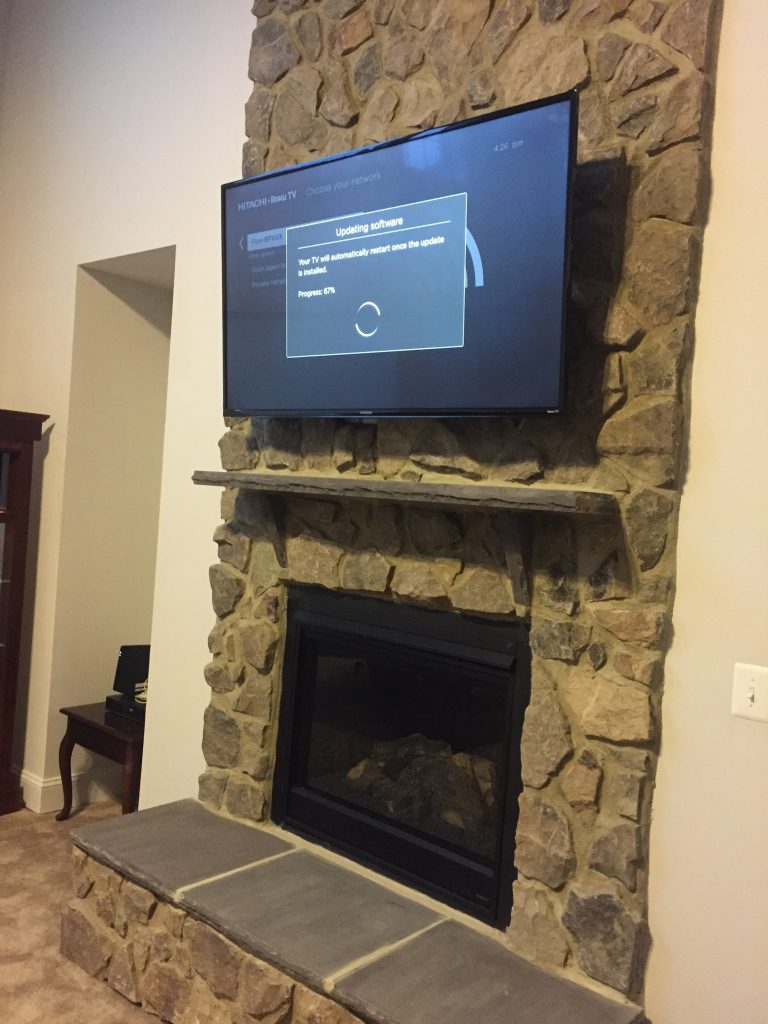 TV mounting over a brick fireplace