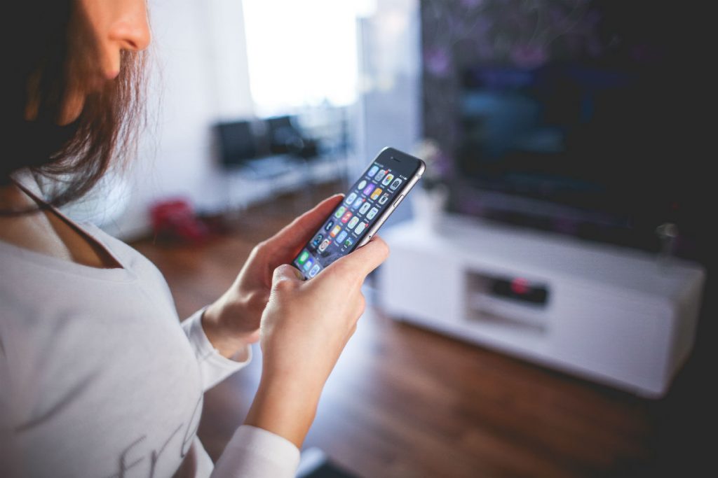 Woman enjoying her iPhone 6