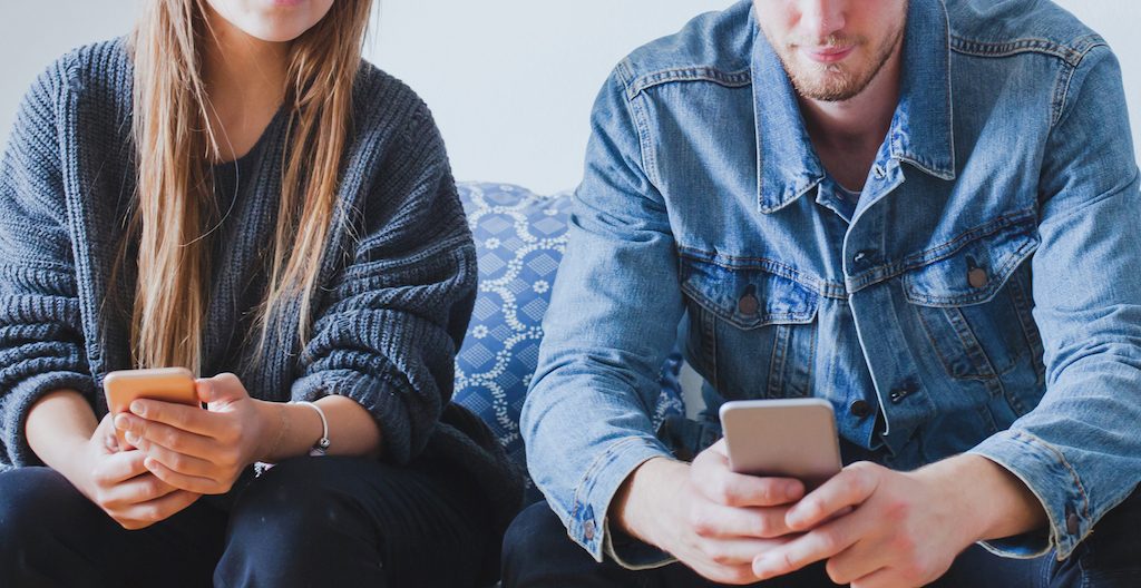 man and woman with phone. how technology affects your relationship