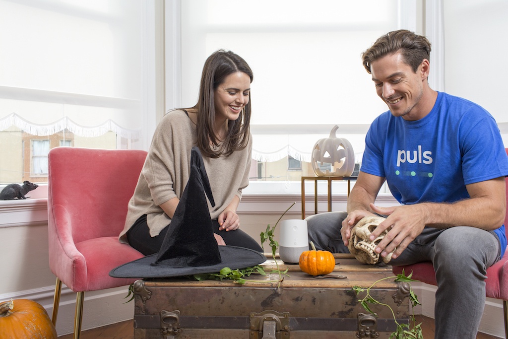 man and women using google home smart assistant