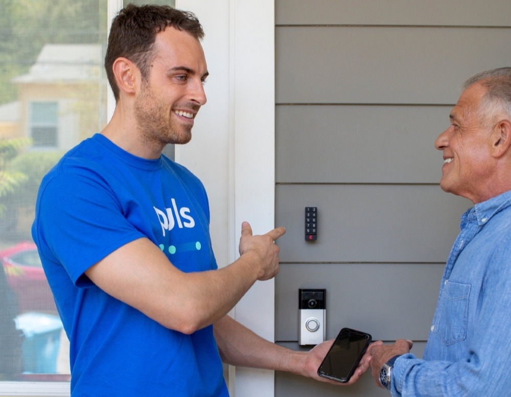 Puls technician demonstrating Ring doorbell