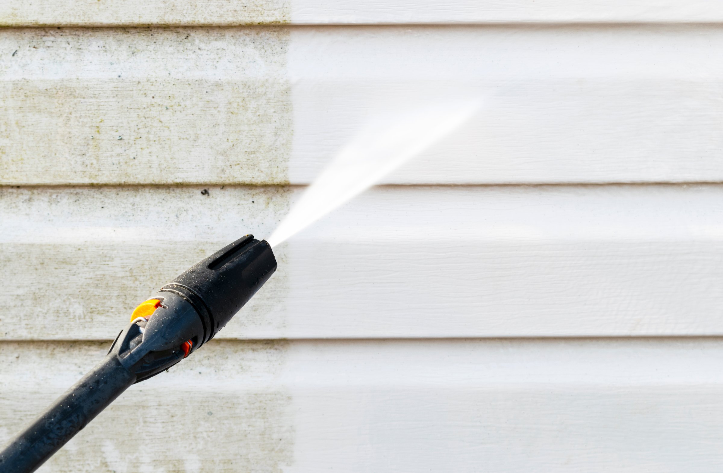 How to Pressure Wash a House Without Destroying Your Paint Job