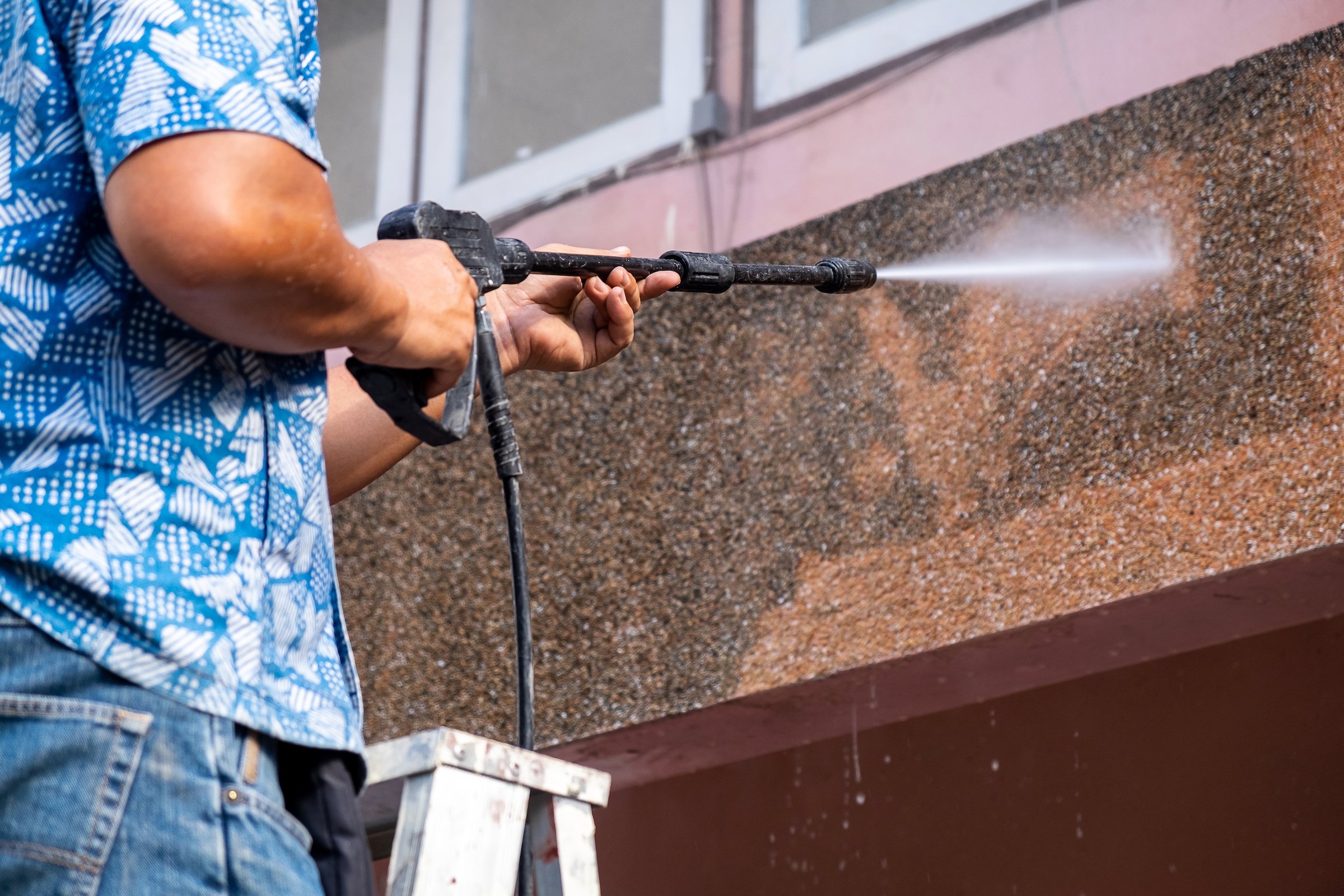 How to pressure wash a house.