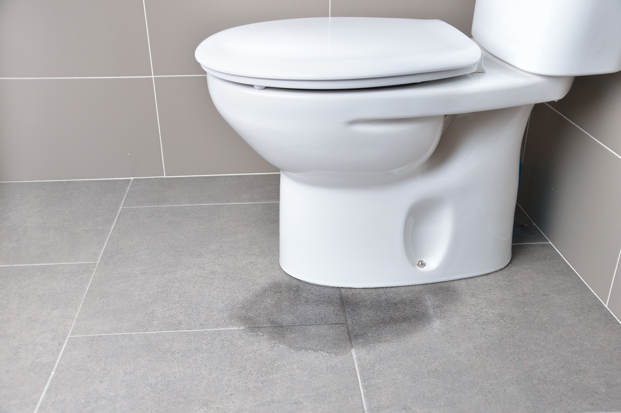 water leaking from middle of toilet